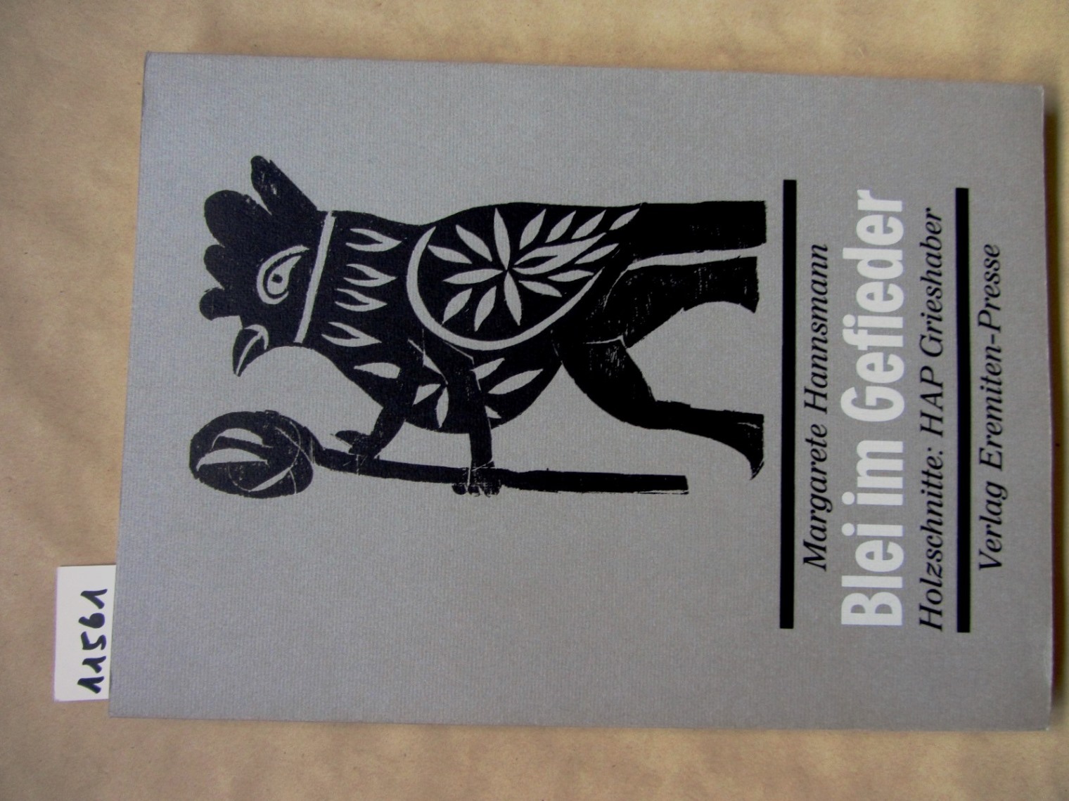 Hannsmann, Margarete:  Blei im Gefieder. Du plomb dans le plumage. Ein Paris-Gedicht. Übersetzt von Henry Fagne. 